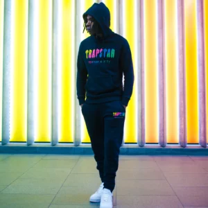 black tracksuit minimal outfit with sneakers model wear